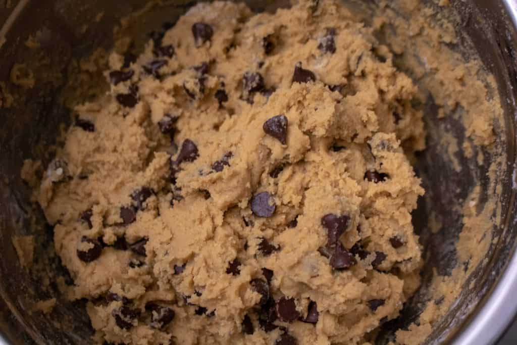 Raw chocolate chip cookie dough in a bowl. 