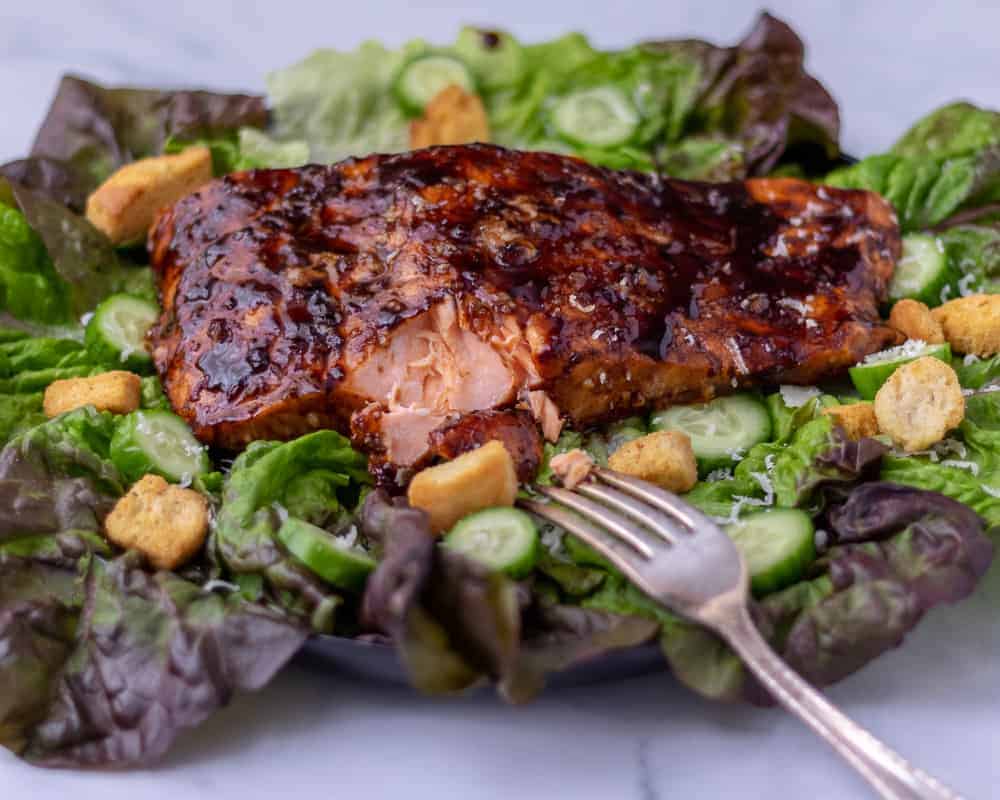 Balsamic glazed salmon on a bed of lettuce