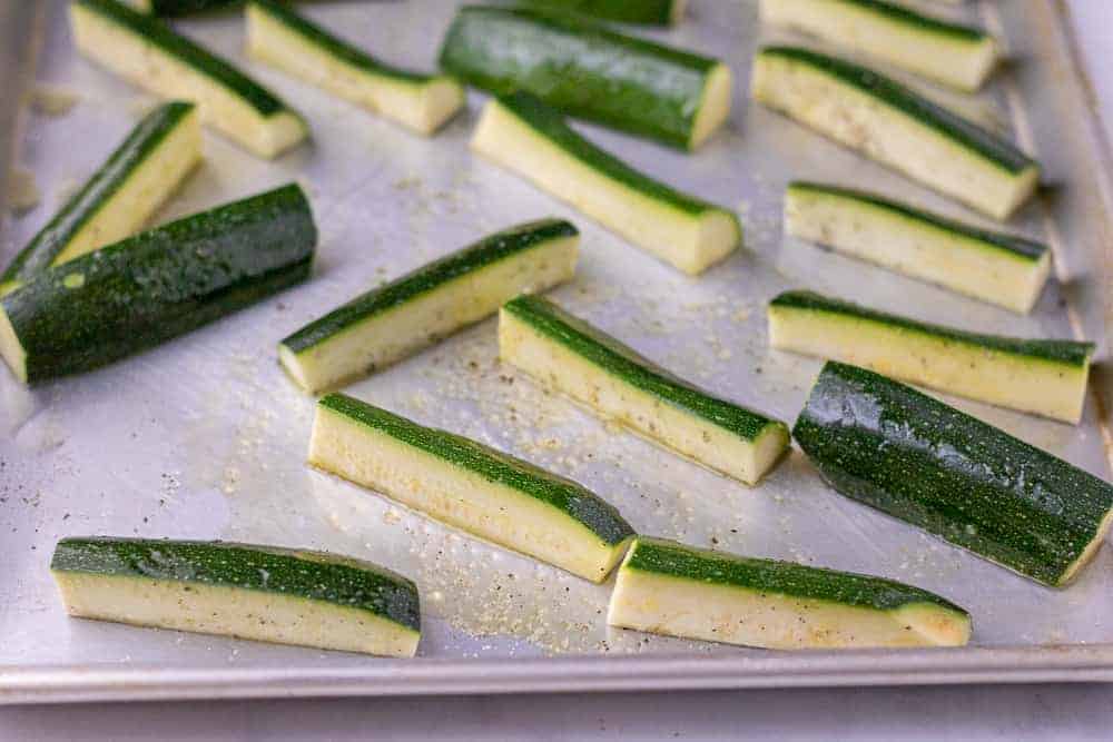 Raw zucchini on a sheet tray