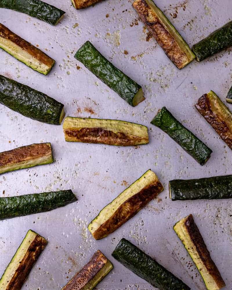 Roasted zucchini on a sheet tray