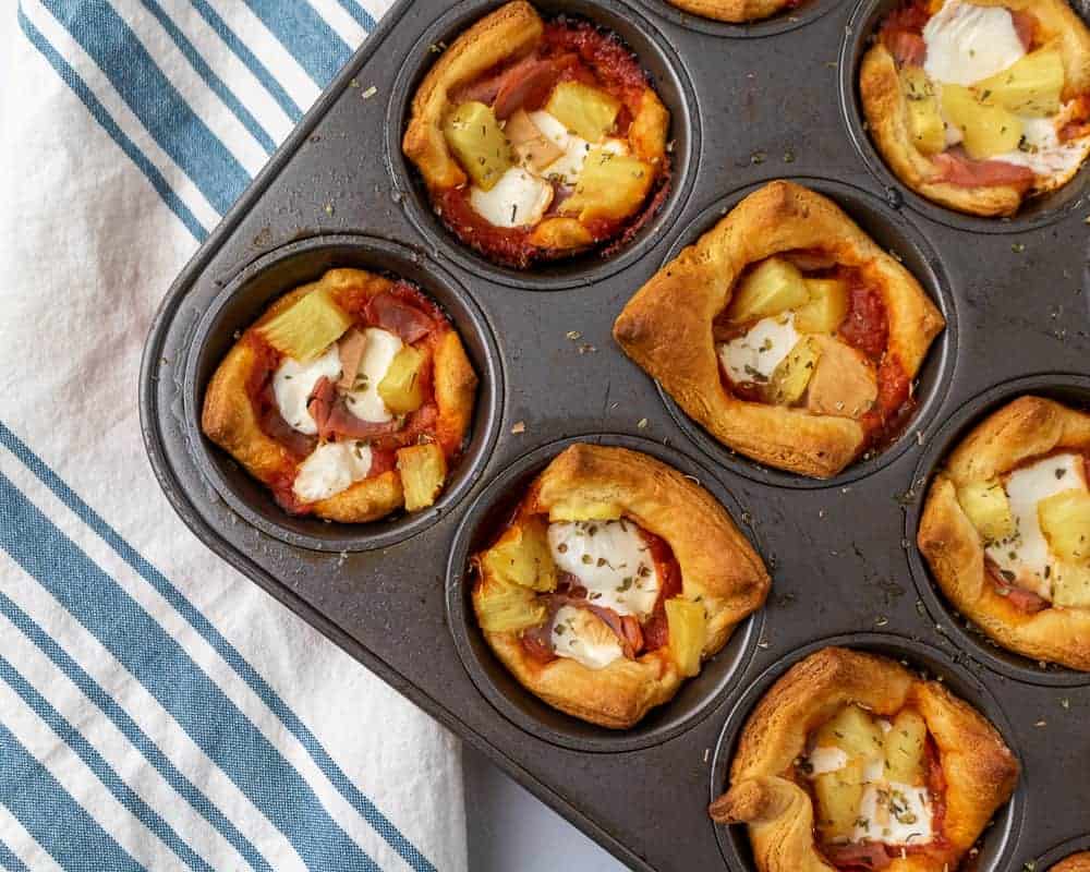 Close up of hawaiian pizza muffins in muffin twin