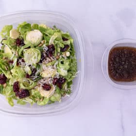 One close up of the shredded brussels sprout salad and dressing