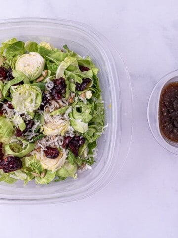 One close up of the shredded brussels sprout salad and dressing