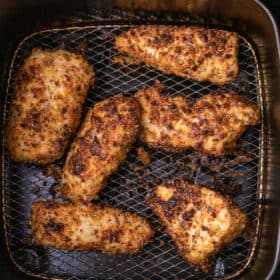 Cooked air fryer parmesan crusted chicken in the air fryer