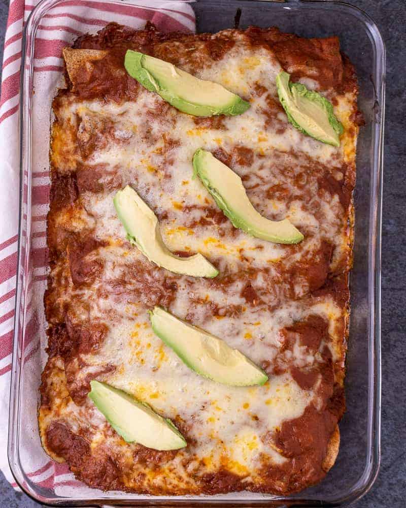 Close up of a plate of chicken enchiladas in the pan