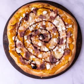 Close up of mashed butternut squash pizza.