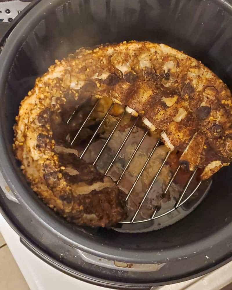 Fully cooked ribs emerging from the slow cooker.