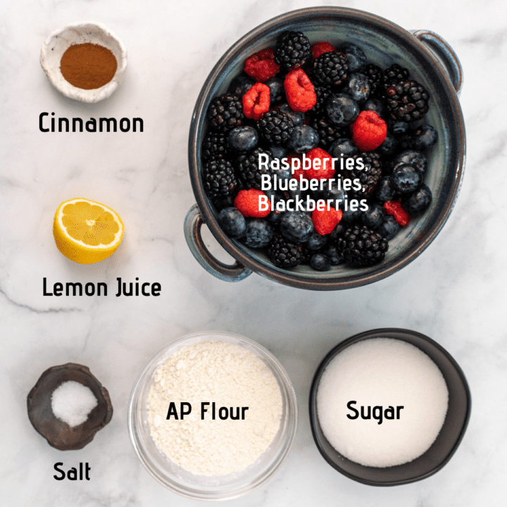 Ingredient image with raw ingredients listed: cinnamon, blueberries, blackberries, raspberries, sugar, all purpose flour, salt, lemon