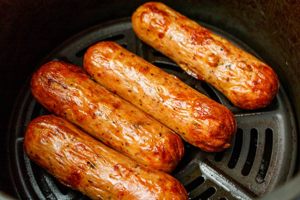 Cooked chicken sausage in the air fryer basket